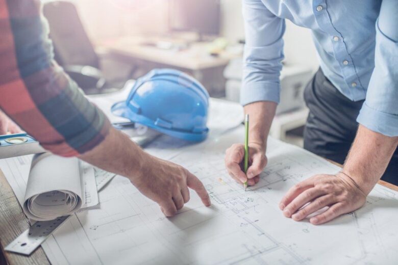 Two Men Reviewing a Blueprint